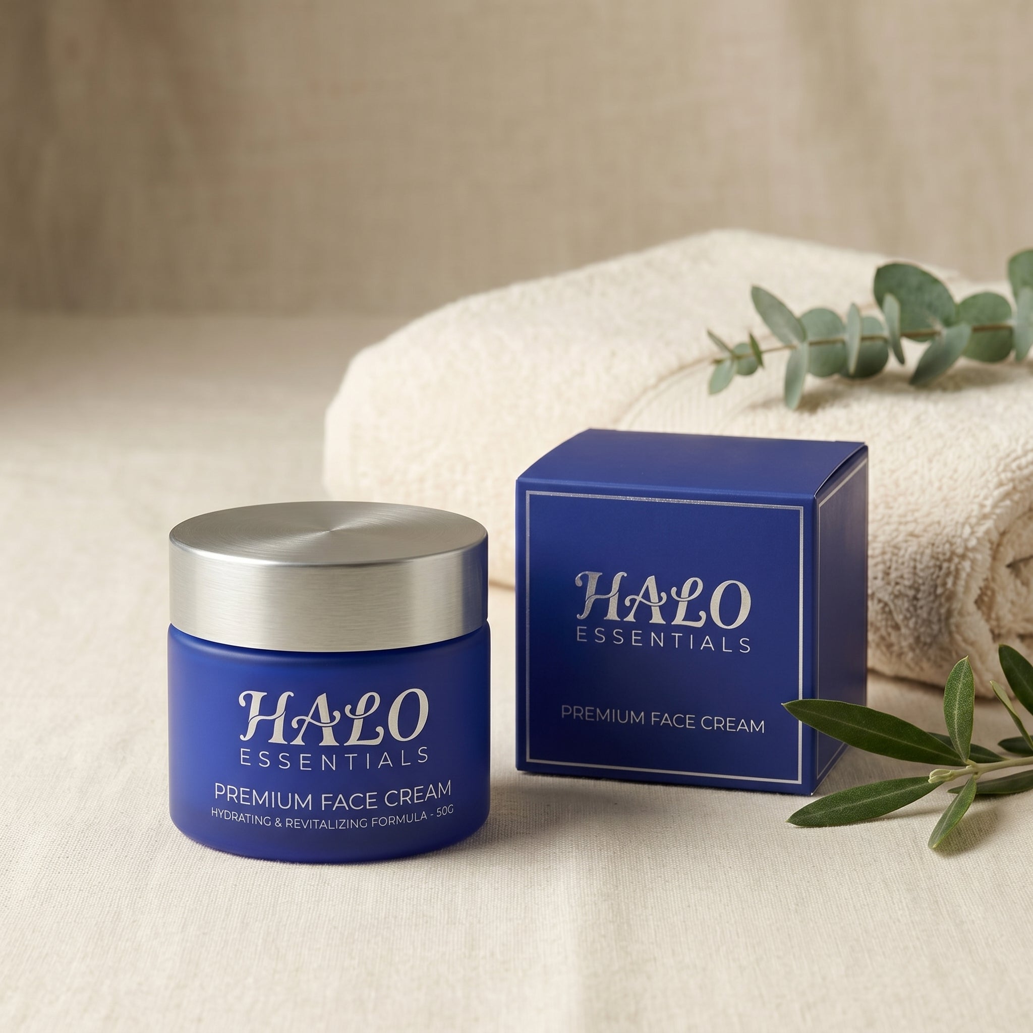 Halo Face Cream with its box, a soft towel and eucalyptus